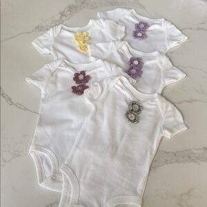 White Baby Onesies with Floral Accents